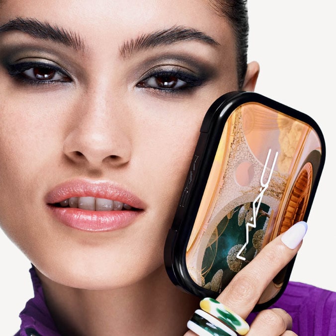 Model with MAC Cosmetics product